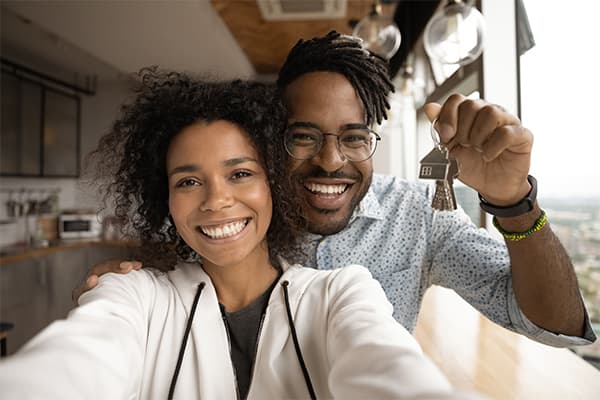https://tower.top10homewarrantyranking.com/wp-content/uploads/2022/10/African-American-married-couple-showing-keys.jpg